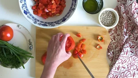 Fresh tomatoes are chopped on a cutting board Stock-Footage 337252499