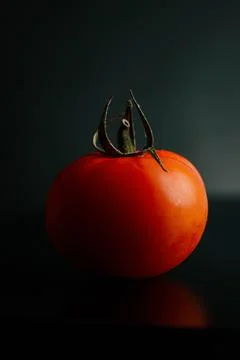 Fresh tomatoes on a black background close-up - Dark food photography Stock Photos