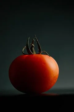 Fresh tomatoes on a black background close-up - Dark food photography Stock Photos