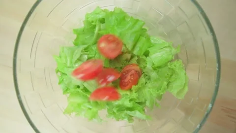 Fresh tomatoes. Cherry tomatoes and lettuce. salad ingredients Vídeo Stock 168983823