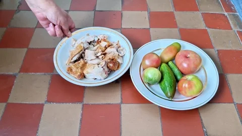 Fresh Tomatoes, Cucumbers and Chicken Prepared for a Homemade Meal Stock Footage 344928039