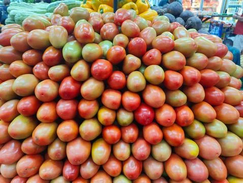 Fresh Tomatoes on Display Stock Photos