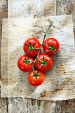 Fresh tomatoes in grungy kitchen Stock Photos