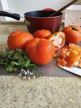 Fresh tomatoes on the kitchen counter Stock Photos