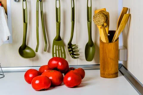 Fresh tomatoes on the kitchen table. Stock Photos