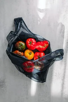 Fresh Tomatoes in Mesh Bag Stock Photos