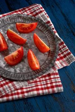 Fresh tomatoes in rustic style on a blue wooden background Foto stock