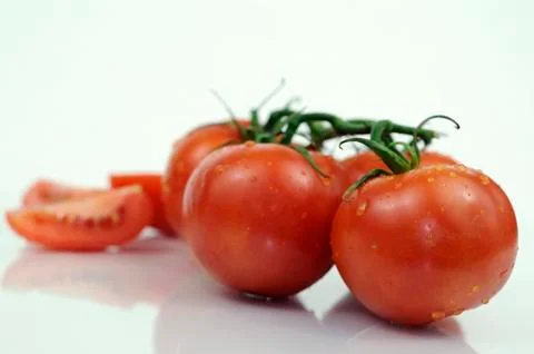 Fresh tomatoes on the vine Stock Photos