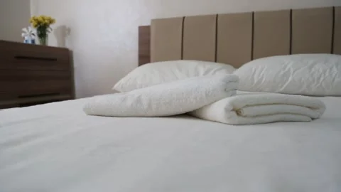 Fresh Towels on Cozy Bedding Stock Footage 339701381