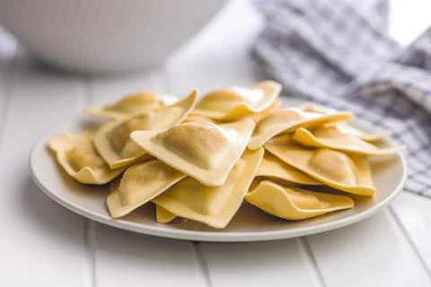 Fresh Triangular Ravioli Pasta on Plate Close-Up Italian Homemade Dumplings.. Fotos de archivo