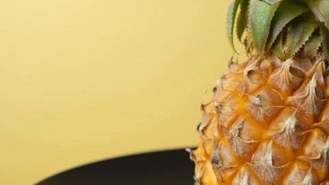 Fresh tropical fruit pineapple turning close up, text space. Stock Footage 337700130