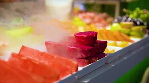 Fresh Tropical Fruit Platter Display with Chilled Mist and Vibrant Colors Stock Footage 342003442