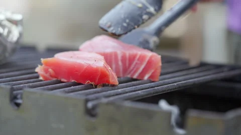 Fresh tuna is grilled. Stock Footage 313299928