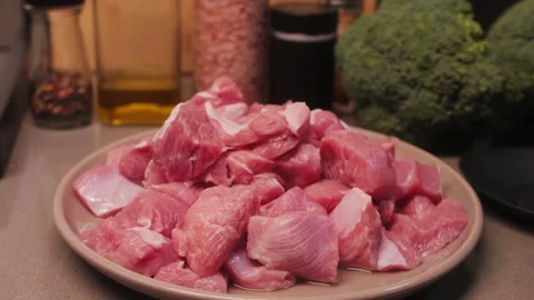 Fresh turkey cut into cubes in the kitchen ready for cooking. Diet healthy food Stock Footage 313136071