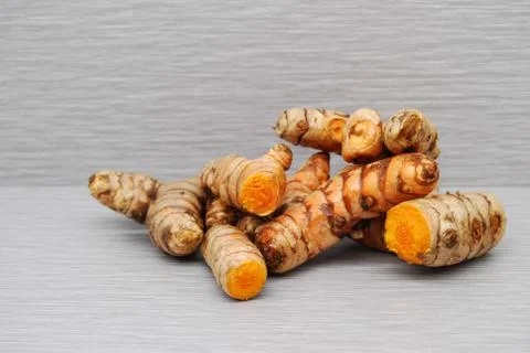 Fresh Turmeric Root on a gray background Stock Photos
