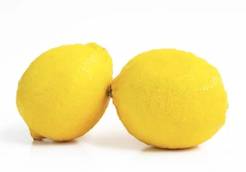 Fresh two lemon isolated on white background. Stock Photos