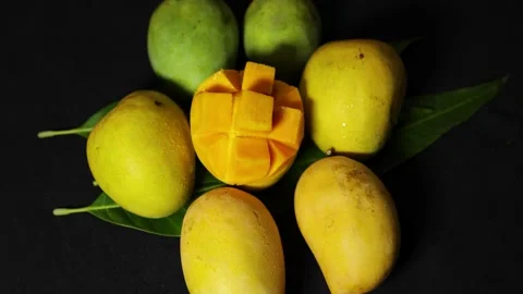 Fresh variety of mango assortment with sliced ripe mango and whole fruits o.. Stock Footage 336646267