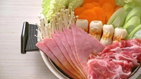 Fresh vegetable and meat platter with carrots broccoli and ham Stock Photos