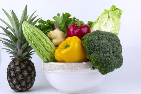 Fresh vegetable in the bow on white background, healthy food for diet cooki.. 库存照片