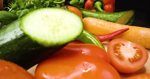 Fresh vegetable in extreme close up, macro shot, tomato, basil, salad, paprika Stock Footage