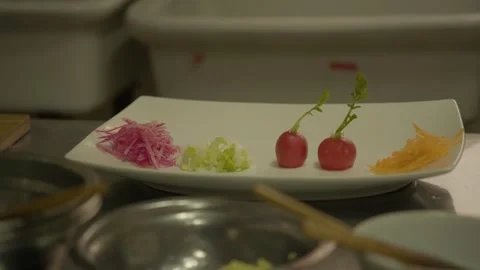 Fresh Vegetable Garnishes Prepared on Plate in Beijing Kitchen for Food Stock Footage 345883077