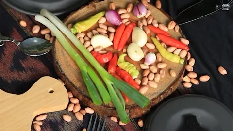 Fresh vegetable ingredients with kitchen utensils ready to cook. Stock Footage 152255565
