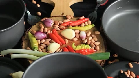 Fresh vegetable ingredients with kitchen utensils ready to cook. Stock Footage 152255615