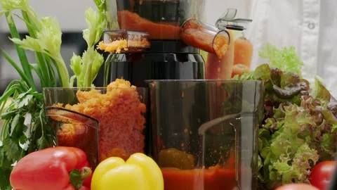 Fresh Vegetable Juicing Process with Colorful Peppers, Celery, and Lettuce .. Stock Footage 312072035