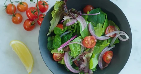 Fresh vegetable salad from above Stock Footage 99733377