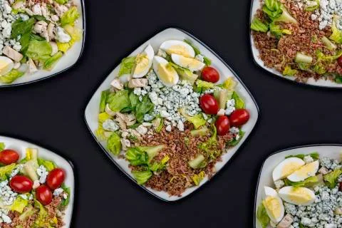 Fresh vegetable salad. Assorted vegetable salad on black background. Foto stock