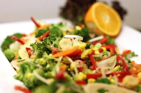 Fresh vegetable salad (broccoli, corn, onion, sweet pepper, rukola, soybean s Stock Photos