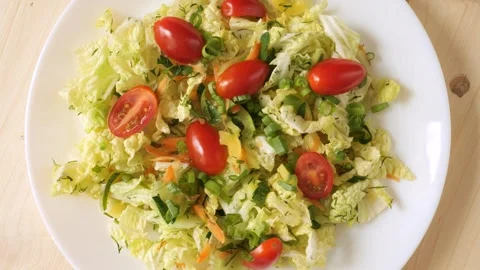 Fresh vegetable salad with cherry tomatoes rotating Stock Footage 339367076