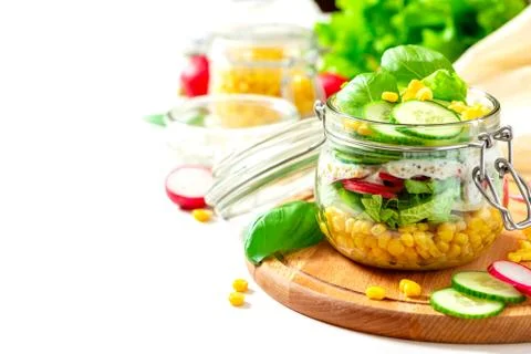 Fresh vegetable salad in a mason jar close-up. Stock Photos