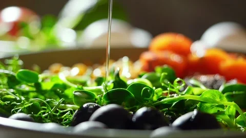 Fresh vegetable salad with micro greens and olive oil. olive oil pouring slow Stock Footage 273511794