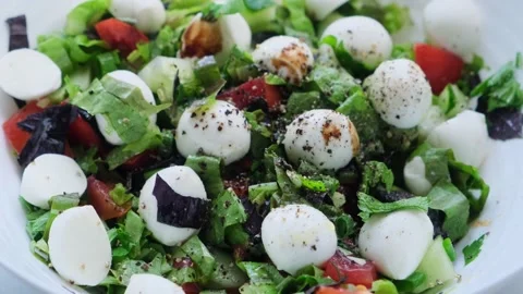 Fresh vegetable salad with mozzarella cheese flavored with balsamic vinegar. Stock Footage 204961909