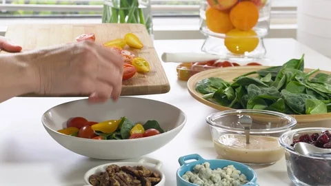 Fresh vegetable salad preparation process. Salad ingredients close up Stock Footage 125971514