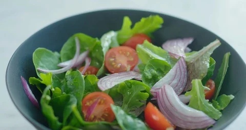 Fresh vegetable salad from the side Stock Footage 99733289