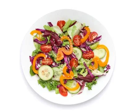 Fresh vegetable salad on white plate with colorful vegetables Stock Photos