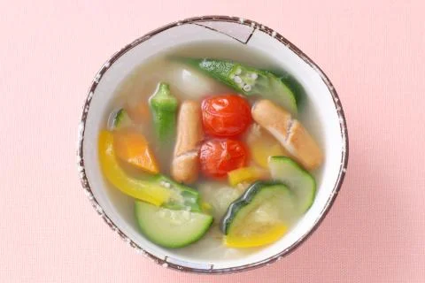 Fresh vegetable soup in a dish on table Stock Photos