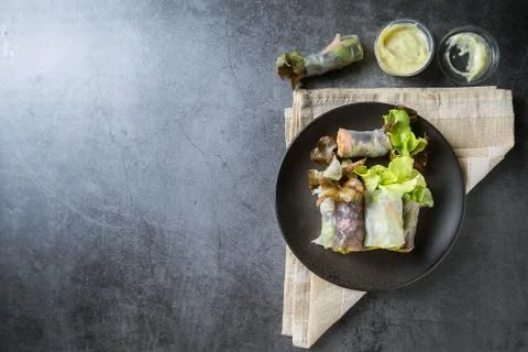 Fresh vegetable spring roll, clean food, salad for weight loss, on dark backg Foto stock