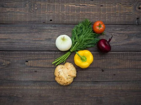 Fresh vegetables and bread on the table Stock Photos