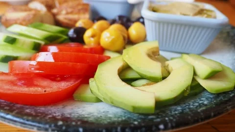 Fresh vegetables and dips on a plate at a cafe Stock Footage 339827870