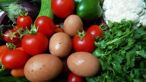 Fresh Vegetables and Eggs Assortment, A colorful assortment of fresh vegeta.. Stock Footage 305039413