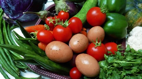 Fresh Vegetables and Eggs in a Basket, A vibrant assortment of fresh vegeta.. Video stock 305038825