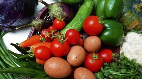 Fresh Vegetables and Eggs in a Basket, A vibrant assortment of fresh vegeta.. Video stock 305039270
