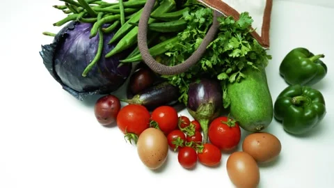 Fresh Vegetables and Eggs in Cloth Bag, A variety of fresh vegetables and e.. Видео 305045513
