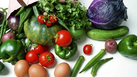 Fresh Vegetables and Eggs from a Paper Bag, A variety of fresh vegetables a.. Vidéo 305054808