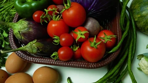 Fresh Vegetables and Eggs on White Surface Footage, A basket filled with fr.. Stock Footage 305030089