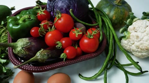 Fresh Vegetables and Eggs on White Surface, A collection of fresh vegetable.. 動画素材 305030374