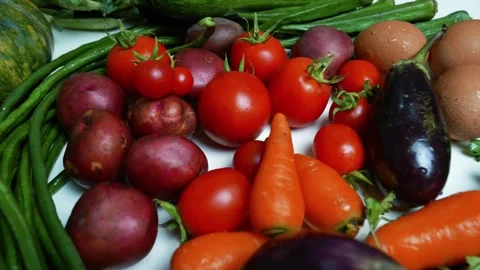 Fresh Vegetables and Eggs on White Surface, A variety of fresh vegetables a.. Vídeos de archivo 305032690